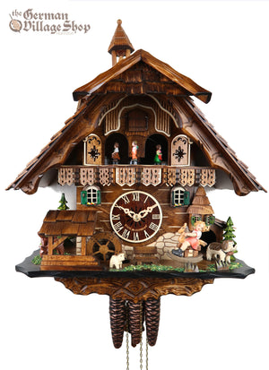 German Cuckoo Clock 1 day mechanical chalet with moving rocking horse and music