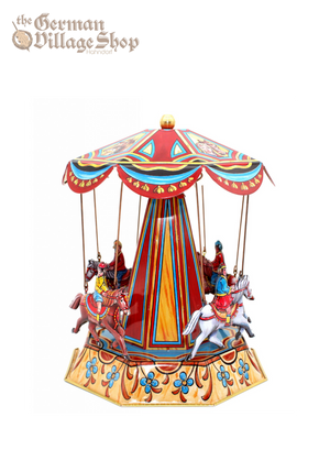 A Traditional tin merry-go-round with detailed graphics and four horses and riders. Made by Josef Wagner – the last tin toy maker in Germany. 