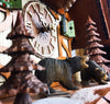 German Cuckoo Clock 8 day mechanical black forest chalet with moving bears and music - close up of bears