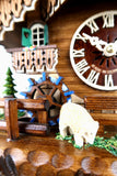  German Cuckoo Clock battery operated black forest chalet with moving shepherd and music - close up of sheep and water wheel