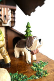  German Cuckoo Clock battery operated black forest chalet with moving shepherd and music - close up of dog