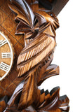 German Cuckoo Clock 8 day mechanical traditional cuckoo bird carvings - close up of carvings