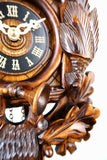 German Cuckoo Clock battery operated After the hunt scene - close up of clock face