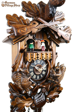 German Cuckoo Clock battery operated traditional hunting scene and squirrel carvings with music