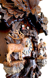 Hones hunting cuckoo clock with stag and Black Forest hunter. Fox hides from hunter