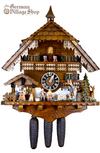 German Cuckoo Clock 8 day mechanical Hones chalet featuring black forest scene. Wood Carver and Walking Peddler