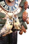 German Cuckoo Clock 8 day mechanical with stag and owl carvings with pine tree and pine cones - close up of owls
