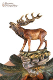 German Cuckoo Clock 8 day mechanical with stag and owl carvings with pine tree and pine cones - close up of stag
