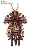 Hones hunting cuckoo clock with stag and Black Forest hunter. Fox hides from hunter