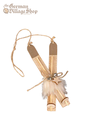 Pair of wooden snow skis with brown faux fur and bells attached. String from the top allows it to be hung as Christmas Tree Decoration.