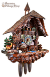 Black Forest Hones Cuckoo Clock. Forest Chalet with dark stained timber and bears with bear cubs