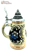 Traditional German beer stein with pewter lid and eagle crest featured at The German Village Shop SA