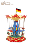 German Tin Carousel toy with four carriages and couples. Balloon and fun fair illustrations on design.