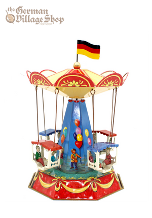 German Tin Carousel toy with four carriages and couples. Balloon and fun fair illustrations on design.