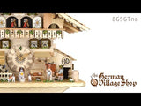 German Cuckoo Clock 8 day mechanical Hones chalet from the black forest with natural timber, alpine horn player and farmer milking cow. Video showing coo coo call and music and moving figurines.