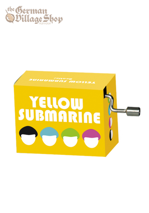 A  rectangular box with a silver hand crank extruding from it. The box is bright yellow and depicts the four Beatles band members, the text says Yellow Submarine.