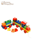 A brightly coloured train is made from an assortment of different blocks which when put together, create the carriages.
